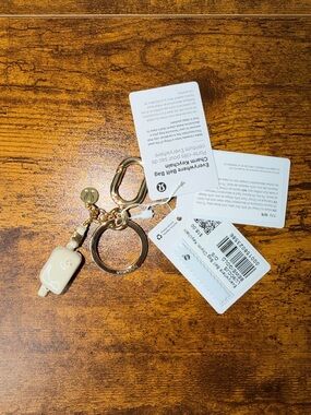 Lululemon Everywhere Belt Bag Keychain Beige White/Gold